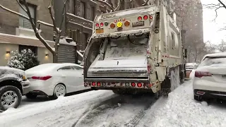 DSNY GARBAGE TRUCK PLOWING THE STREETS OF NEW YORK CITY DURING WINTER STORM KENAN.