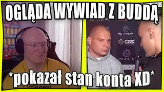 Dzinold ogląda wywiad z Buddą *pokazuje stan konta*