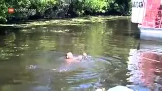 MAN LETS GATORS EAT A MARSHMALLOW OUT OF HIS MOUTH