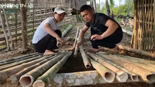 The boy helps the girl make a pig pen and the ending