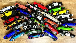 Box full of various miniature cars Jaguar, Peugeot, Renault, Hyundai, Mazda, Volvo, Honda, Opel #975