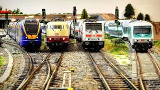 German h0 modeltrains from different eras in service.