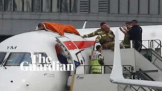 Activist climbs plane as Extinction Rebellion takes protest to London airport