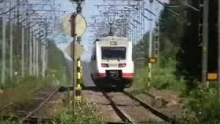 Pendolino 241 passes Toppi level crossing on Tuomioja