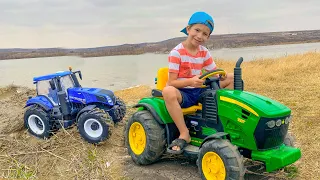 Darius helps tractor playing rescuing team for tractors - Kidscoc Club