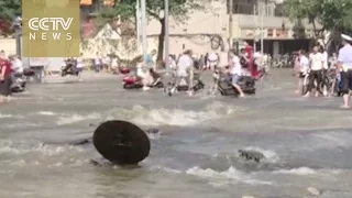 Footage: Street flooded after water pipe bursts in SW China