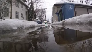 Neighbors band together to help drain nature-made lake in Minneapolis alley