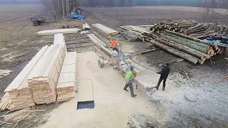 Time lapse of portable sawmill turning logs into lumber