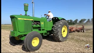 Antique Tractors Plowing the Earth.