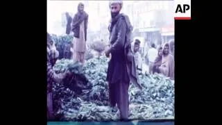 SYND12/12/71 SCENES IN RAWALPINDI, SHOWING CAMOUFLAGED VEHICLES AND ANTI INDIA BANNERS