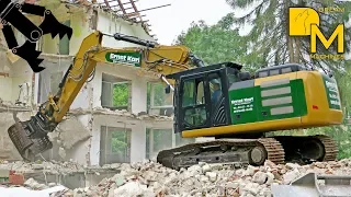 Down with the bricks! Hydraulic digger CATERPILLAR 330F + grapple demolishing residential building