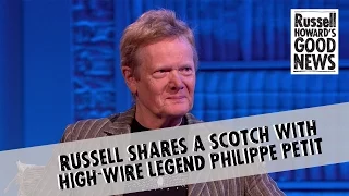 Russell shares a scotch with high-wire legend Philippe Petit