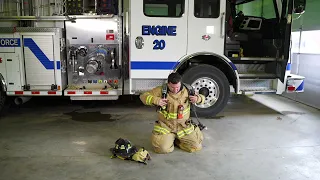 Donning Firefighter Turnout Gear (TOG) and Self-Contained Breathing Apparatus (SCBA).