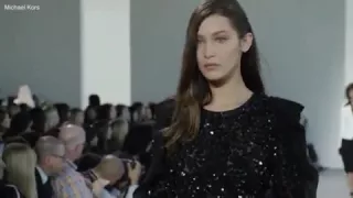 Bella Hadid takes painful tumble on Michael Kors runway while in six-inch heels