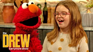 8-Year-Old Emmy Eaton Asks Elmo Questions Like What's His Favorite Food