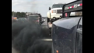 Ram 3500 is Rolling coal while towing GMC