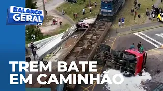 Trem cortou um caminhão pela metade no bairro cajuru; motorista ficou ferido