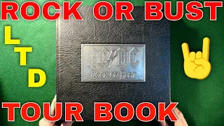 AC/DC ROCK OR BUST TOUR BOOK.THE FIRST OFFICIALLY ENDORSED BOOK BY AC/DC.IN LTD METAL CASE.