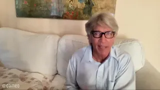 Eric Roberts congratulates Chris Cabin on the VHS Trailer Game win