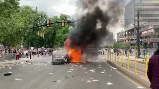 Protesters set fire to a police car in Salt Lake City on May 30, 2020.