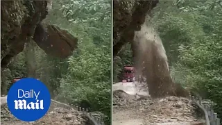Dramatic footage shows mountainside collapsing after heavy rain