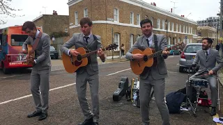 Buskers playing Help (The Beatles) in Hackney