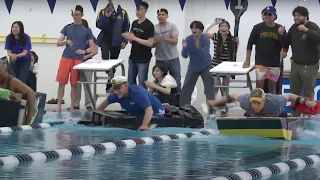 Battle of the Boats: Students, professors race in cardboard boat competition