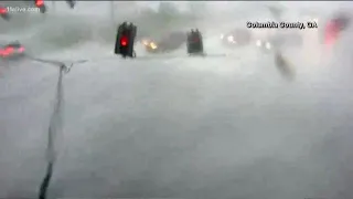 Huge wind gust throws traffic lights into Georgia intersection