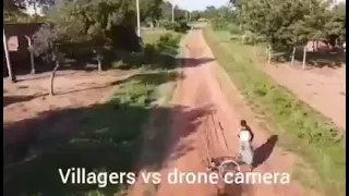 hilarious as villagers run away from a drone camera.