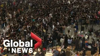 Hong Kong protesters occupy airport for third day