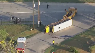 Multiple taken to hospital with minor injuries after crash flips school bus on side in SE Houston