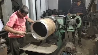 Expert man a drum face cutting on a lathe