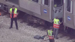 Red Line service suspended on North Side after train with 24 passengers derails; no injuries