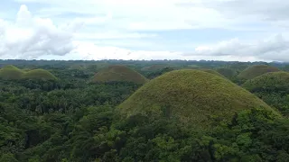 CHOCOLATE HILLS OF BOHOL. Native Boholanos Farming in the Lowlands and Shadows of Chocolate Hills