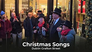 Sean Boland a Brown Thomas Doorman serenading people of Grafton Street with some Christmas songs