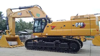 Watch 395 excavator CAT loading to small truck