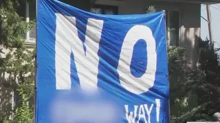 'No F$#in Way!' sign in front of planned migrant shelter