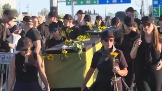 Israeli protesters carry mock coffins as they call for the release of the Gaza hostages