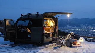 Car camping on a snowy mountain at minus 5 degrees Celsius