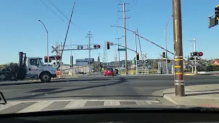 trains blocks malfunction on a street while train is arriving