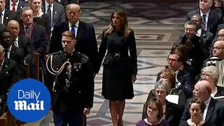 Donald and Melania Trump arrive at the funeral of George H.W. Bush