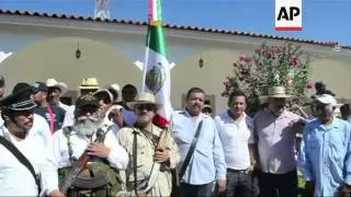 Hundreds of vigilantes gathered in the western Mexico state of Michoacan on Monday to celebrate the