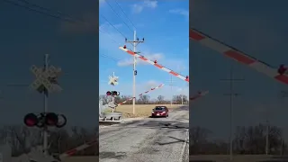 Car nearly hits crossing gate