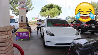 I spot Tesla at gas station "Helliarious".