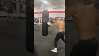 Throwing left hook BOMBS on the heavy bag