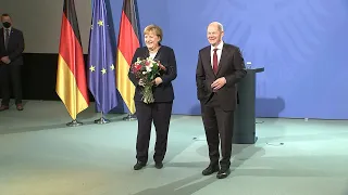 Handover between Angela Merkel and new German chancellor Olaf Scholz | AFP