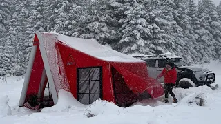 OUR TENT WAS COVERED IN SNOW DURING THE SNOWSTORM