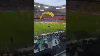 Wow a parachute almost landed in the stadium before France v Germany match