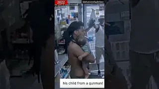 Dad holding baby fights off Gunman #shorts #brave