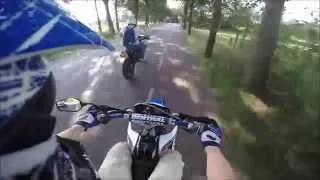 Playing on a dirt road by motorbike